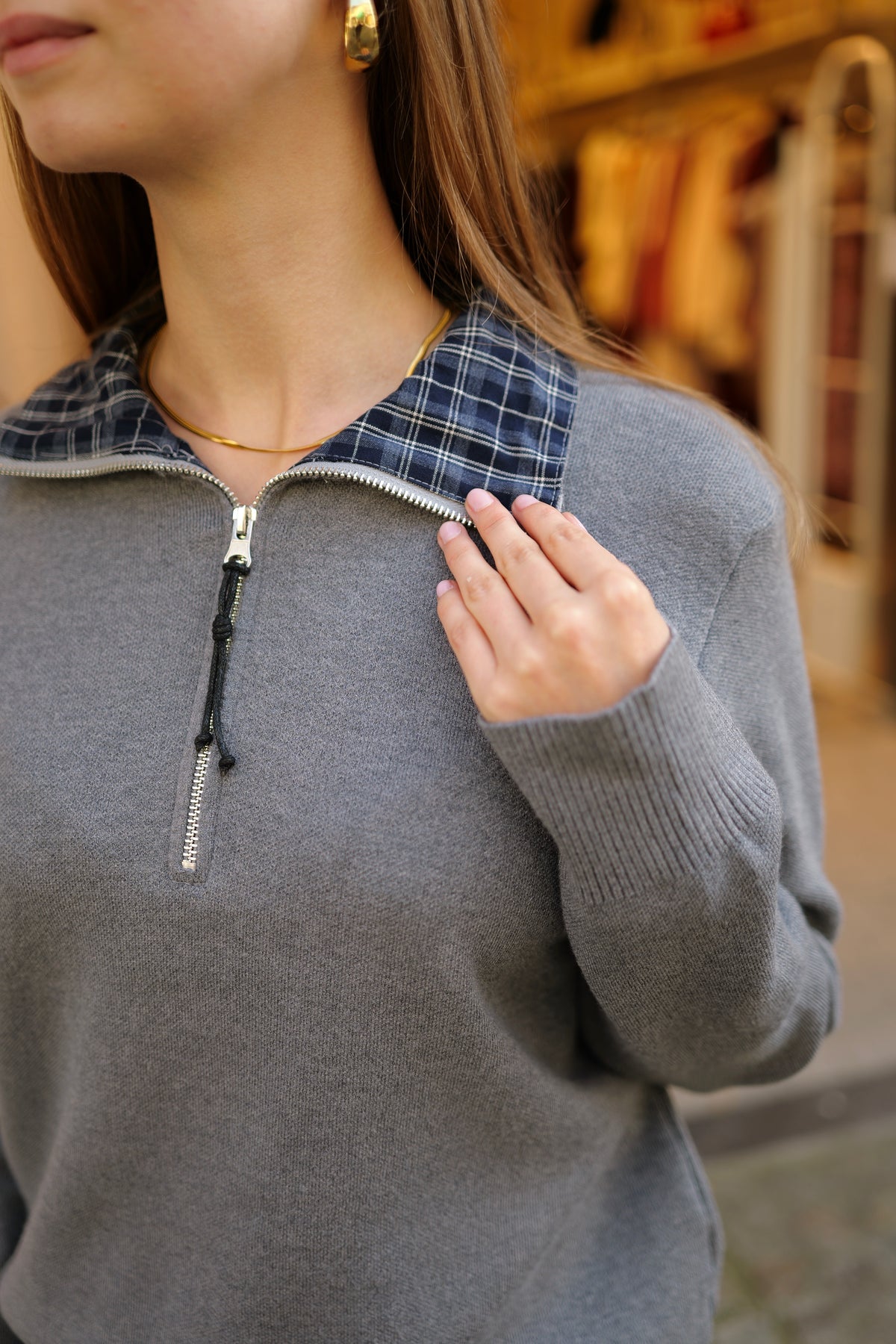 Pull zippé col à carreaux