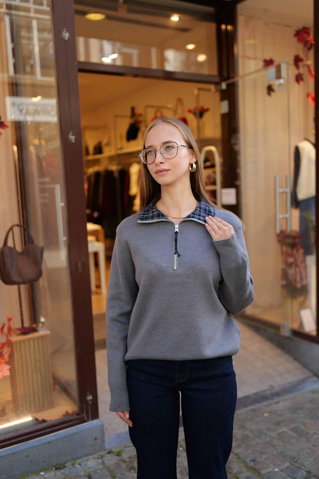 Pull zippé col à carreaux